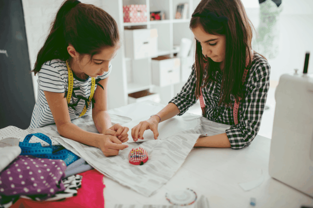 kids creating easy sewing projects from colorful fabric scraps