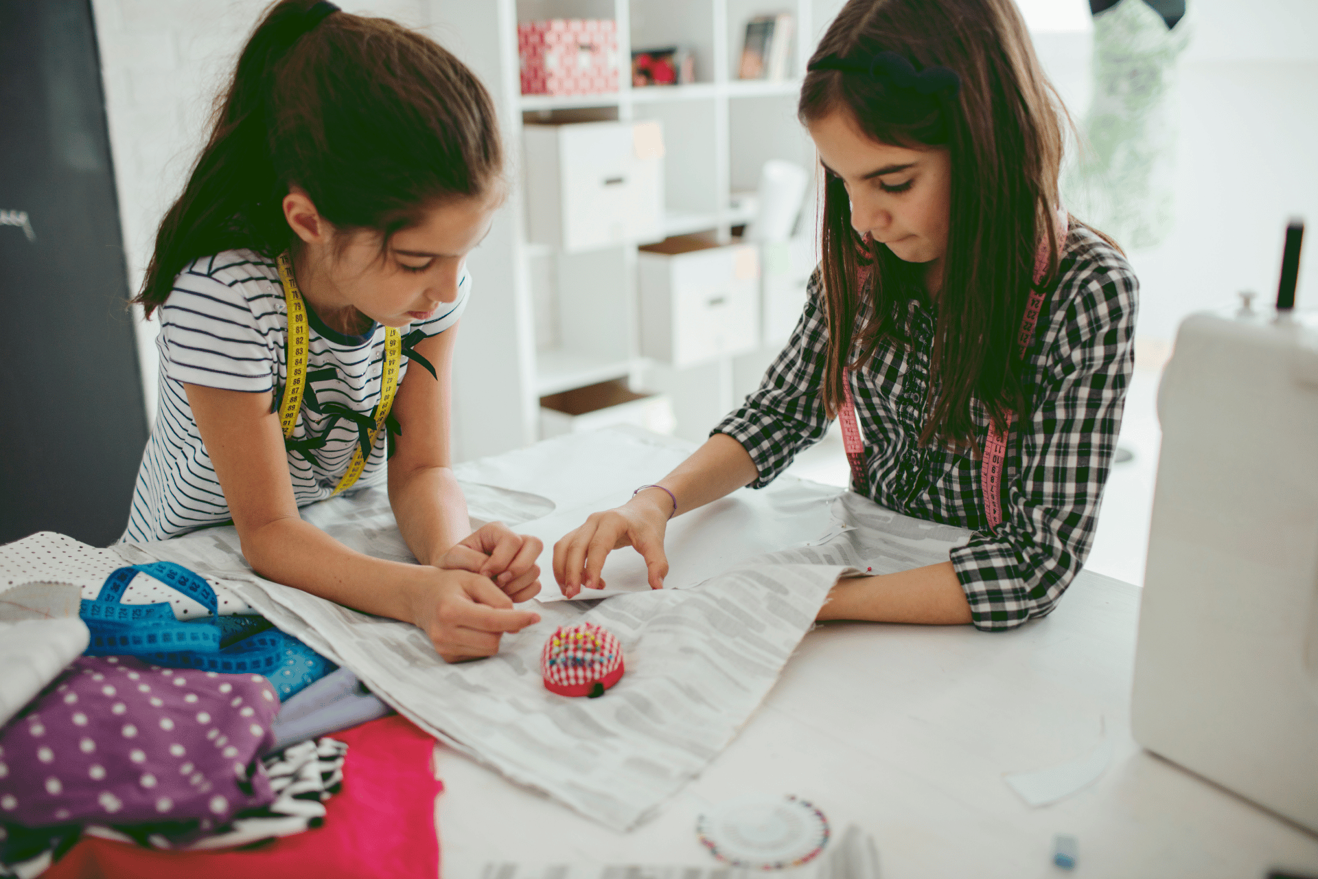 kids creating easy sewing projects from colorful fabric scraps